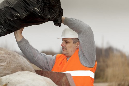Workers segregating construction waste materials